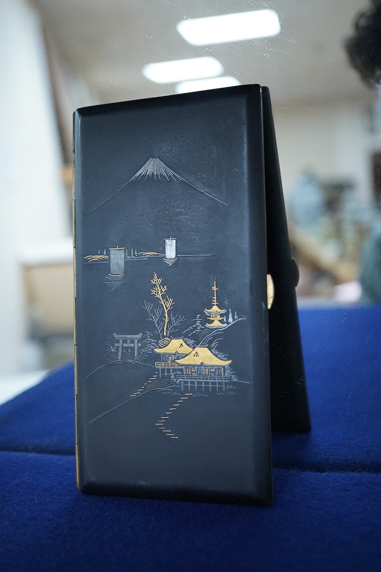 A Japanese photograph album, late 1940's to include banknotes and a telegram, together with a cigarette case